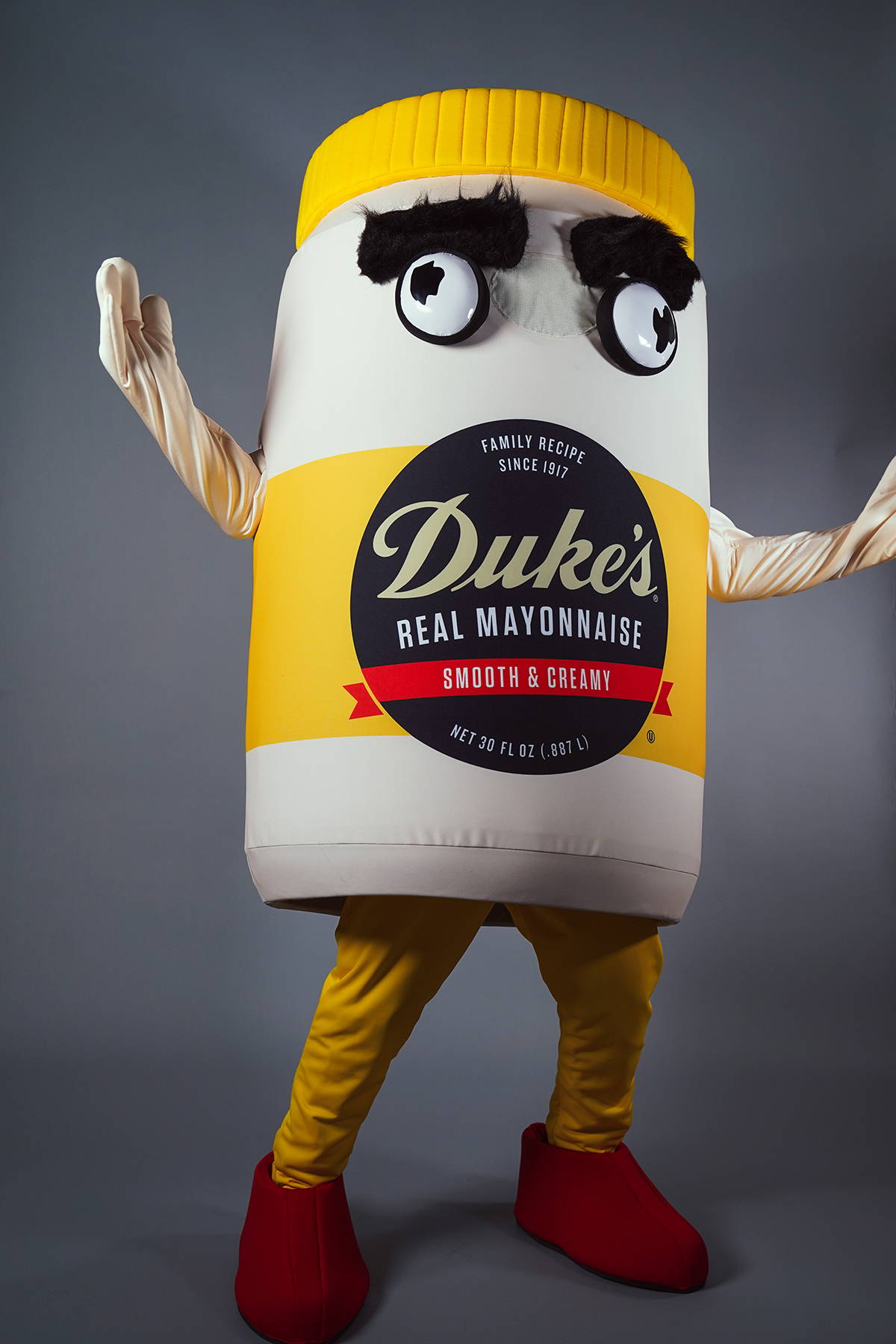 Tubby, Duke’s mayonnaise-jar mascot, with big eyebrows and red shoes